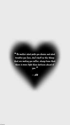 a black heart with a quote on it