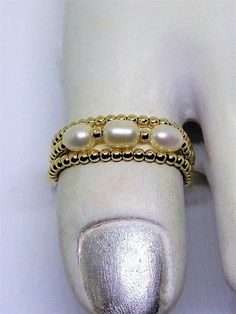 14kt Solid Gold Toe Rings White Pearl Toe Ring Stacking Toe Ring 14k Gold Thumb Ring Triple Rings Real 14kt Gold Toe Rings BuyAny3+Get1Free 14kt Solid Gold Toe ring is made with Real Genuine 14kt Gold Beads & Genuine Freshwater Pearls. These are stretchy & very comfortable. Select Size needed. If ordering for other than toe, please send a message with your ring size stated. * Buy Any 3 items + get 1 additional item for Free. This listing represents 1 item. * Do Not Click on Buy for the f Gold Thumb Ring, Gold Thumb Rings, Gold Toe Rings, Triple Ring, Thumb Ring, Ring Stacking, Toe Ring, Thumb Rings, Body Jewellery