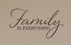 the words family is everything written in cursive writing