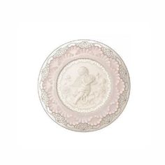 a pink and white plate with an angel on it