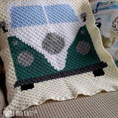 a crocheted pillow sitting on top of a couch