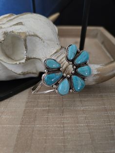 Sterling Silver 7 Teardrop Turquoise Stones Naja Cuff Bracelet Native American Handmade by Rita Dawes Stamped D by the Artist Naja Measures 1 1/2" x 1 1/2" Turquoise Stones, Turquoise Stone, Cuff Bracelet, Turquoise Necklace, The Artist, Cuff, Turquoise, Bracelet, Sterling Silver