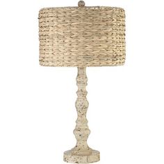 a white table lamp with a beige shade