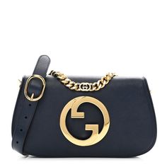 This is an authentic GUCCI Suede Roxy Calfskin Blondie Chain Shoulder Flap Bag in Blue Agata. This stylish baguette is crafted of luxurious blue suede leather. It features a gold chain strap, an adjustable leather shoulder strap with gold links, and a prominent brass Gucci interlocking GG logo at the front. The front flap opens to a matching leather interior with a zipper pocket. Gg Logo, Gucci Shoulder Bag, Wallet Chain, Blue Suede, Flap Bag, Leather Interior, Blue Bags, Bag Straps, Chain Strap