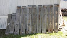 a wooden fence with stars painted on it