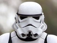 a star wars stormtrooper helmet is shown in close up