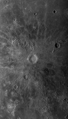 the surface of the moon is shown in black and white, with many small dots on it