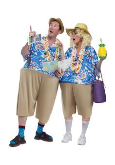 two people dressed in costumes standing next to each other and one holding a pineapple