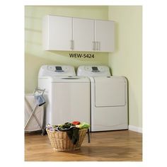 a white washer and dryer sitting next to each other in a laundry room