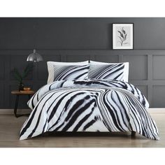 a zebra print comforter set in black and white