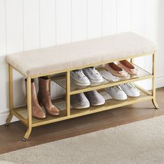 several pairs of shoes are lined up on a shelf