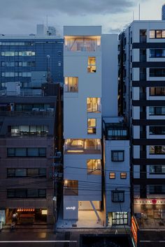 an aerial view of some buildings at dusk