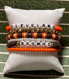 Hand made stackable heishi bracelet made from polymer clay, plastic and metal beads.  Set of 6 Bracelets are made on stretchy cord.  7 inches in circumference 1973 @holliesearrings on Facebook for more Adjustable Stacked Heishi Beads Stretch Bracelet, Orange Heishi Beads Stretch Bracelet As Gift, Team Bracelets, Football Bracelet, Cleveland Browns Football, Heishi Bracelet, Browns Football, Brown Bracelet, Clay Bracelet