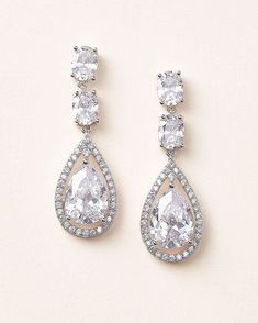 One of our most popular styles, bridal earring Tara is designed with oval CZs that cascade into a pear shaped drop encircled by a halo of stones. Cubic zirconia Measures 1.75" Hypoallergenic, lead-free & nickel-free Style #1189 Bridal Earring, Bridal Earrings Drop, Stone Wedding, Cubic Zirconia Jewelry, Popular Styles, Cz Earrings, Free Style, Earrings Drop, Cz Stone