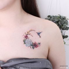 a woman with a flower tattoo on her chest