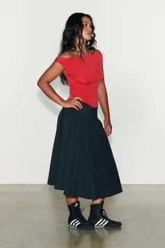 Introducing The Deba Midi Skirt in Onyx by Peachy Den. The Deba Midi Skirt is a techy spin on a classic half circle skirt. She’s a mid-rise midi featuring a deep v-shaped waistband complete with invisible front zip closure that leads into a gathered midi, creating the perfect floaty a-line fit. She is made from the sam