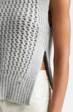 The Italian label's signature blend of relaxation and luxury shines in this alpaca-kissed sweater-tank boasting ribbed edges and an ornate openwork body. Mock neck Side slits 48% alpaca, 23% metallic fibers, 21% polyamide, 8% wool with 55% cotton, 45% polyester contrast Dry clean or machine wash, dry flat Made in Moldova Designer Clothing Elegant Sleeveless Knit Sweater, Winter Open Knit Sweater Vest, Elegant Layering Sweater Vest, Chic Open Knit Sweater Vest, Chic Open Knit Sweater Vest For Fall, Chic Sleeveless Pointelle Knit Sweater, Fitted Cashmere Pointelle Knit Tops, Fitted Pointelle Knit Cashmere Tops, Winter Sleeveless Pointelle Knit Sweater Vest