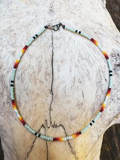 ☆ mint, black, white, red, orange, yellow ☆ lobster clasp and metal wire  ☆ sizes can be from 13in-16in and will have an extension chain ☆ beads are size 8/0  If you have any questions please DM me!! Nickel Free Multicolor Beaded Necklace For Festivals, Southwestern Adjustable Single Strand Beaded Necklace, Adjustable Single Strand Southwestern Beaded Necklace, Southwestern Single Strand Adjustable Beaded Necklace, Green Handmade Southwestern Beaded Necklace, Southwestern Style Choker Necklace With Colorful Beads, Bohemian Festival Single Strand Choker, Adjustable Multicolor Southwestern Necklace, Western Beaded Choker Necklace