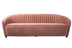 a pink velvet couch with black legs