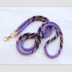 This Lanyard is made from Czech glass seed beads in violet, purple and gold. Very flexible and comfortable to wear. These lanyards not only make your everyday work outfit a little more stylish, but they are also functional accessories to hold your ID badge. They also make the perfect gift! Lanyard length : 38.5 inches (98 cm) Length with holder : 20 inches (51 cm) To browse more of my bead crochet lanyards please follow the link: http://www.etsy.com/shop/lutita?section_id=16455806 Return to the Lutita Shop: www.etsy.com/shop/lutita Crochet Lanyards, Crochet Lanyard, Lanyard Teacher, Card Necklace, Violet Purple, Modern Necklaces, Functional Accessories, Bead Crochet, Badge Holder