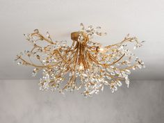 a gold chandelier hanging from the ceiling