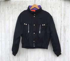 "*ITEM: Vintage Seiller Ski Wear Black Jacket Large 1990's Colourblock Skiing Cold Weather Snow Bomber Coats Winter Size L *ITEM DETAILS: 👇🏻 Please be aware that all vintage items will usually show a few signs of wear or fading due to age, but anything visible such as stains or holes, and serious flaws have been photographed.For any further information on this item please contact us and we will be happy to help. *SIZE: LARGE *ACTUAL SIZE MEASUREMENT: 👇🏻 *PIT TO PIT(WIDTH):22.5\"INCHES *LENGT Black Windbreaker For Skiing In Winter, Black Windbreaker For Winter Skiing, Sporty Black Windbreaker For Snowboarding, Black Windbreaker With Pockets For Skiing, Vintage Windbreaker For Ski Season Streetwear, Vintage Ski Outerwear For Ski Season, Black Skiing Outerwear With Pockets, Retro Ski Season Outerwear, 90s Ski Jacket