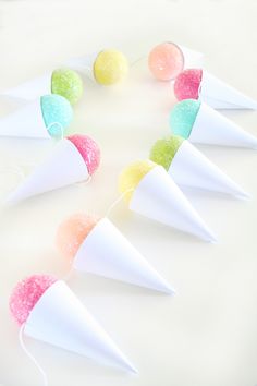 there are candy cones and candies in the shape of cones on top of each other