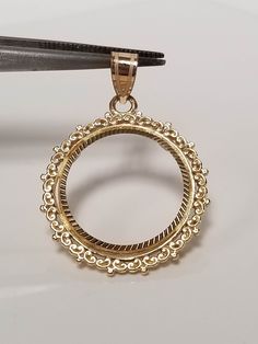 "Thanks for shopping our vintage estate store. We tend to sell well below wholesale and truly hope you enjoy all of our items. Many of the items are one of a kind, so please enjoy scrolling through the pictures and hopefully something will catch your eye. Spots are from reflection or camera. Estate 14k yellow gold bezel holder 1/10-coin rope twist pendant. Works great with any 1/10 gold coins. Length: 1 1/8\" Diam: 3/4\" Weight: 2.34 grams Bail: 3mm Nice 14k coin bezel pendant." Ornate 14k Stamped Jewelry For Formal Occasions, Antique Yellow Gold Diamond Cut Necklace, Heirloom Yellow Gold Jewelry With Bezel Setting, Victorian 14k Yellow Gold Jewelry, Victorian Round Diamond Cut Jewelry, Ornate Yellow Gold Round Pendant Necklace, Luxury 14k Stamped Round Jewelry, Victorian Style Round Diamond Cut Jewelry, Luxury Jewelry With Filigree And Round Pendant