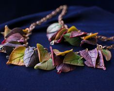 If you like autumn and you are looking for a piece of suitable jewelry, just look at this boho necklace)) The necklace with fall leaves of polymer clay and copper chains -- this jewelry will be good to complement any outfit. Each leaf was made and painted separately, you will not find two identical ones The necklace turned out to be quite unusual and very autumnal. MATERIALS: Handmade polymer clay leaves, copper chain. Painted with pastel. А protective lacquer coating. PARAMETRES: Choker length: Bohemian Leaf Necklace For Gift, Polymer Clay Leaves, Clay Leaves, Fall Necklace, Leaves Necklace, Custom Figurines, Boho Leaves, Elven Jewelry, Autumn Necklace