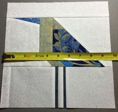 a piece of paper with a bird on it and a measuring tape next to it