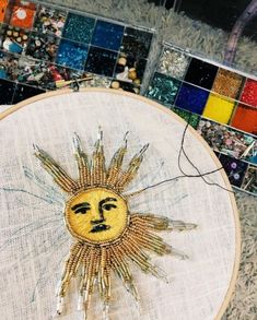 the sun is made out of beads and thread, but it's not so bright