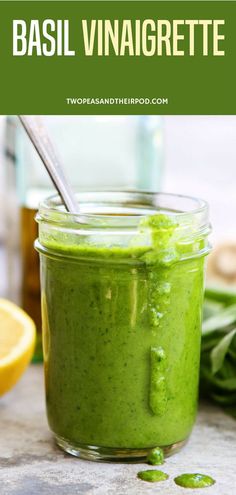 basil vinaigrette in a glass jar with a spoon