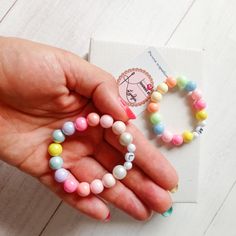 This listing is for 1 Colorful children's bracelet. Colorful plastic 6 and 8 mm beads were used to make the bracelet. strong elastic and letters of your choice. Please enter 1. the desired letter, 2. the child's age or arm circumference 3. choose color arrangement number 1 or 2 Important! The bracelet is NOT suitable for small children due to the small parts that can be swallowed!  Please select a size! !! Caution !! The model shown is for a 5-6 year old child! If different than this size, it is Hypoallergenic Plastic Bracelets For Gift, Hypoallergenic Plastic Bracelets As Gift, Plastic Stretch Bracelet With Round Beads For Gift, Plastic Stretch Bracelet With Round Beads As Gift, Playful Multicolor Name Bracelet For Gifts, Playful Multicolor Name Bracelet Gift, Cute Round Stretch Bracelet As Gift, Playful Letter Beads Bracelets For Birthday, Playful Birthday Bracelets With Letter Beads