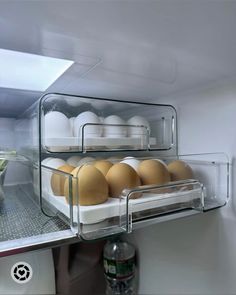 an open refrigerator filled with lots of eggs