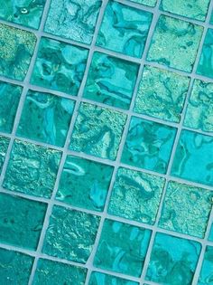 a close up view of blue glass tiles