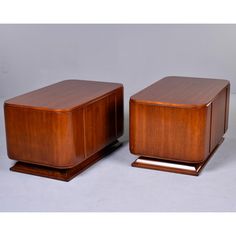 two wooden boxes sitting on top of each other