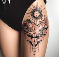 a woman's thigh with clouds and sun tattoo on her leg, showing the back side