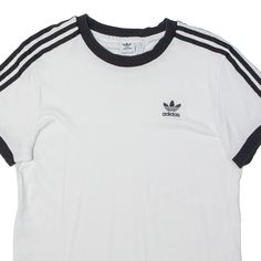 Item is in used condition. Item has a faint mark to the front. >Size: UK 10 >Armpit To Armpit: 19" >Armpit To Cuff: 2" >Collar To Hem: 29" White Relaxed Fit T-shirt With Three Stripes, Basic Crew Neck T-shirt With Three Stripes, Athleisure Three Stripes T-shirt For Streetwear, Three Stripes Relaxed Fit T-shirt For Streetwear, Casual Streetwear T-shirt With Three Stripes, Basic Adidas Logo Crew Neck Tops, Basic Adidas Crew Neck Tops, Sporty T-shirt With Three Stripes For Streetwear, Sporty Streetwear T-shirt With Three Stripes