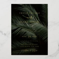 an elegant tropical wedding with palm leaves and gold foil on the front, black background