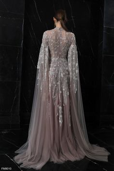 Indulge in elegance with the Azzure Couture FM9010 evening dress from the Spring 2024 Collection. Elevate your style and grace with this exquisite masterpiece. Silver Fantasy Gown, Silver Gowns Elegant, Azzure Couture, Starfall Ball, Dress Soiree, Fairy Ball, Luxury Gowns, Silver Gown, Collection Ideas