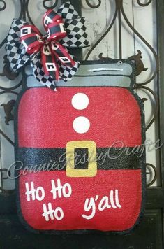 a door hanger with a santa clause suitcase on it's side and the words ho ho y'all