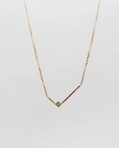 This minimalist solid gold necklace features a simple geometric L shape gold bar with a single square shape emerald, for an asymmetrical look that's both simple and strikingly graphic. The piece looks equally good worn alone or stacked with other styles.details: 18k yellow gold the square shape emerald is measured 2mm x 2mm the L shape is measured 8mm x 16.5mm 18” length with 2” extender spring-ring closure One piece in 18k yellow gold in stock, ready to ship! Pendant Necklace Simple, Square Necklace, Solid Gold Necklace, Gold Bar Necklace, Jewelry Accessories Ideas, Coral Jewelry, Emerald Necklace, Classy Jewelry, Jewelry Design Necklace