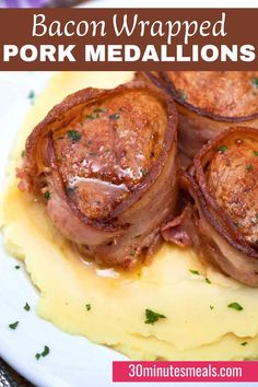 bacon wrapped pork medallions on top of mashed potatoes