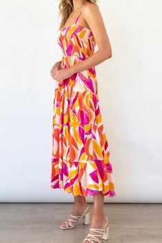 Bright Vibrant Abstract Sleeveless Smocked Bodice Summer Maxi Dress This is a timeless dress that is simple but definitely not basic.Vibrant bright colors in abstract watercolor artistic print.Easy to dress up with espadrille heel sandals for a bohemian style, down with ballet flats or cowboy boots.Wide adjustable spaghetti shoulder straps.Elasticized smock bodice that's form fitting and stretchy.Flowing and breathable summer worthy tiered A-line maxi with a wide bottom hem.Girl-next-door femini Stylish Maxi Dress, Maxi Sundress, Maxi Robes, Vacation Dresses, Summer Maxi Dress, Printed Maxi, Style Chic, Tiered Dress, Cami Dress