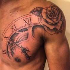 a man with a rose and clock tattoo on his chest