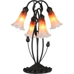 a lamp that is on top of a metal stand with three flowers in the middle