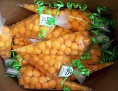 carrots wrapped in plastic bags with green ribbons