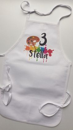 a white apron with the number three stella painted on it's front and back