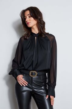 It's all in the details! Chic & modern, the twisted neck, softly gathered bodice & transparent chiffon sleeves of our luxe Silk Georgette shirt gives it an artistic edge. Dress it down with jeans or up with Crepe Pants. Elie Tahari Exclusive Long Sleeve Silk Georgette Shirt with Twist Neck & Keyhole Detail 91% Silk, 9% Spandex Relaxed Fit; Runs true to size Model is 5'9" and wearing size S Dry Clean Only Imported Style #: ETR44209 Chic Evening Blouse With Gathered Sleeves, Elegant Tops With Gathered Sleeves For Night Out, Elegant Blouse With Gathered Sleeves For Night Out, Modern Blouse For Fall Night Out, Modern Fall Blouse For Night Out, Modern Blouse For Night Out In Fall, Trendy Blouse With Blouson Sleeves For Night Out, Feminine Sheer Sleeves Blouse For Night Out, Chic Sheer Sleeve Blouse For Work