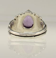 Sterling Silver Amethyst Ring/ One of a Kind Ring/ February Birthstone Ring/ Victorian Amethyst Ring/ Egyptian Ring/ Gift for Her/ Handmade Silver Ring R1069- Sterling Silver Ring with a 11 x 9 mm Pear Shape Amethyst. Size 9.25. I can size it to fit, just contact me. No charge to size down, and no charge for one size up. Pretty Ultra Violet Amethyst Ring with scrolls which give it a Victorian or Egyptian Flair. Would make a great Gift for Her or for Yourself. It is One of a Kind made by me from Purple Teardrop Amethyst Ring, Gift Pear-shaped Purple Amethyst Ring, Teardrop Amethyst Ring In Purple, Teardrop Amethyst Ring As Gift, Fine Jewelry Teardrop Purple Ring, Fine Jewelry Purple Teardrop Ring, Purple Teardrop Fine Jewelry Ring, Pear-shaped Amethyst Rings With Accent Stones, Spiritual Teardrop Gemstone Rings